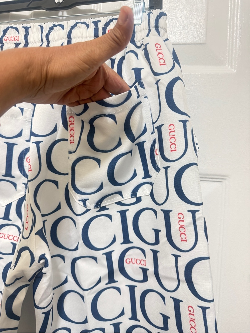 Beautiful shorts featuring a navy-and-red logo print with red accents. new - Picture 8 of 11